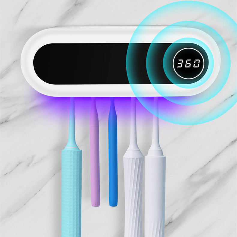 Support à brosses à dents mural avec distributeur de dentifrice dans une salle de bain