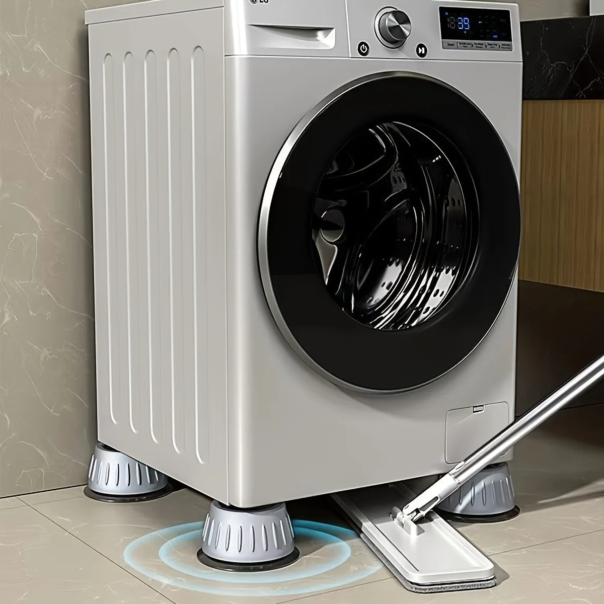 Quatre coussinets anti-vibration installés sous les pieds d'une laveuse