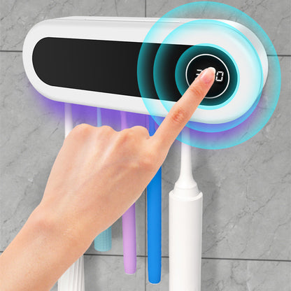 Support à brosses à dents mural avec distributeur de dentifrice dans une salle de bain