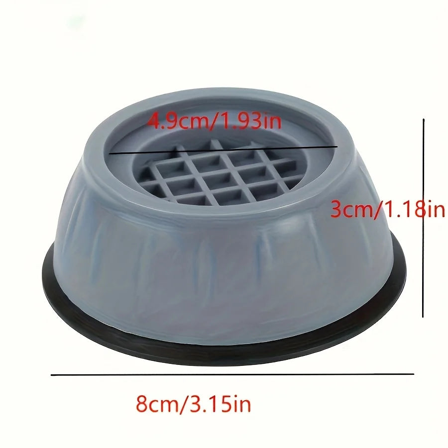 Quatre coussinets anti-vibration installés sous les pieds d'une laveuse