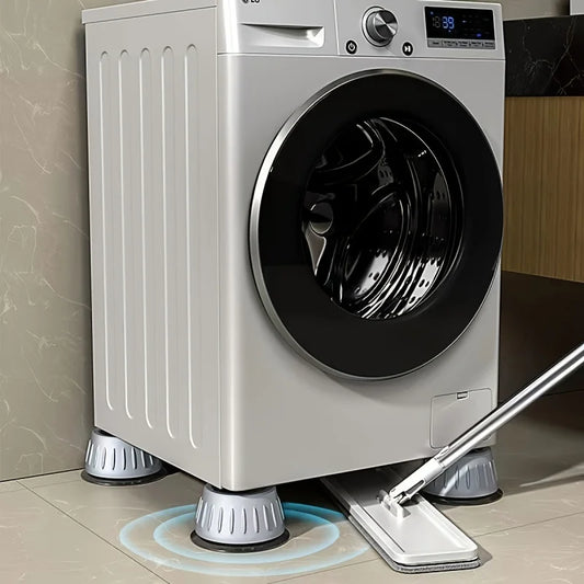 Quatre coussinets anti-vibration installés sous les pieds d'une laveuse